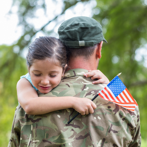 military discounts Child hugging soldier while holding flag